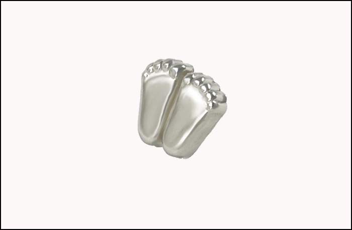 an electroplated silver gilt finish replica of what is intended to represent the size of the feet of a ten-week old fetus.